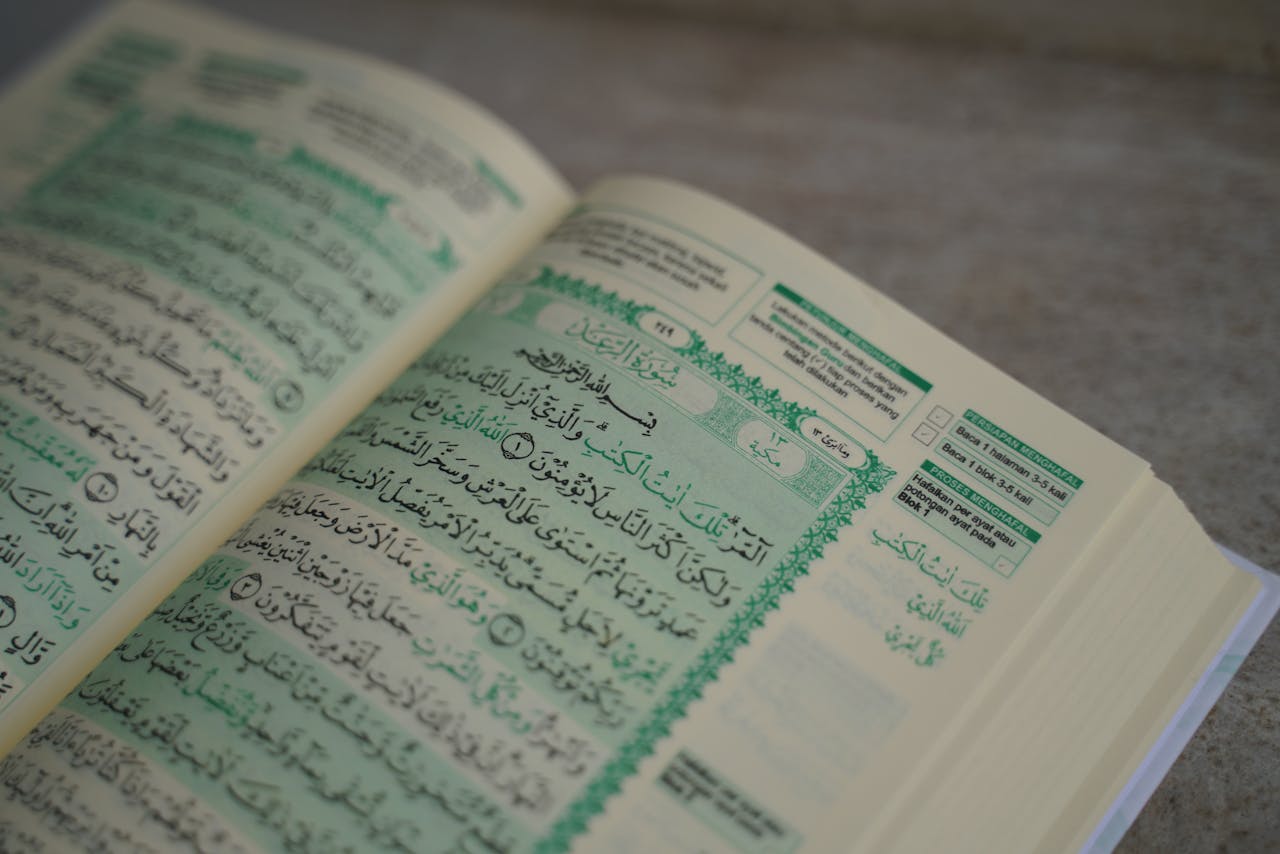 services-img Open Quran displaying Arabic script, close-up view, suitable for religious and educational themes.